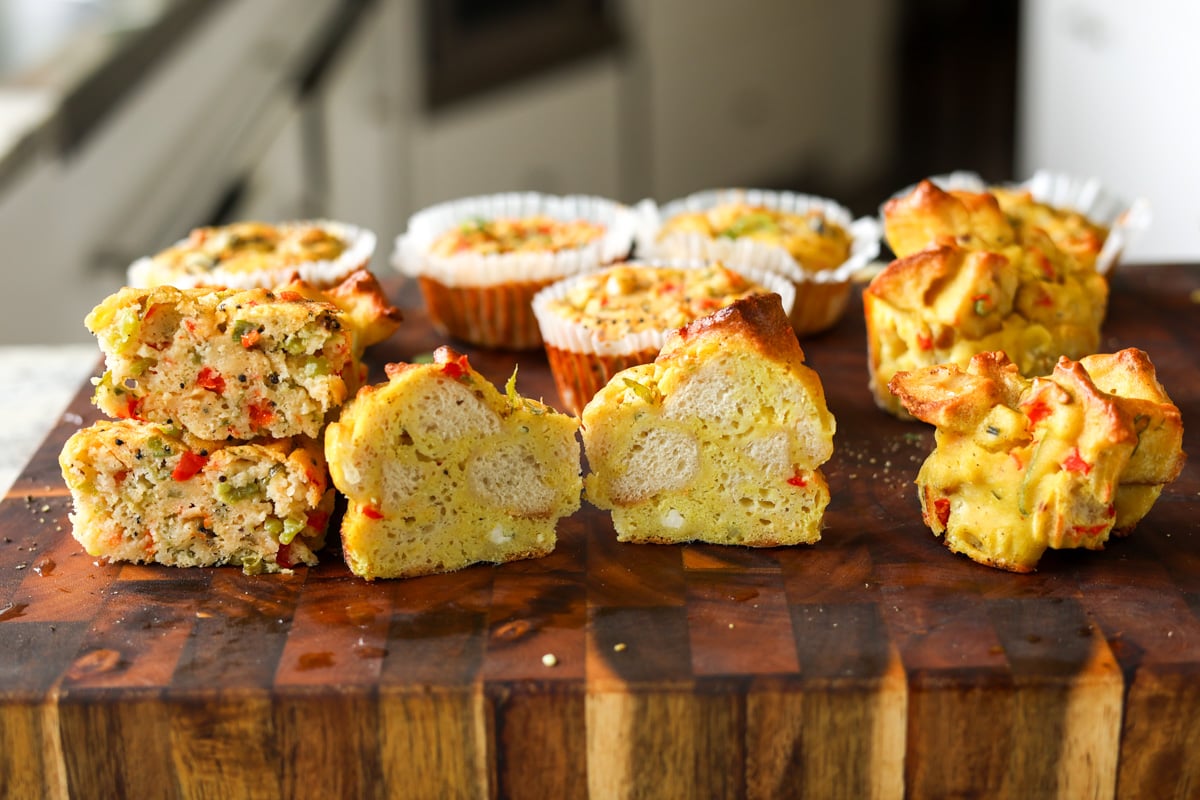 moong egg muffins on the cutting board with one cut in half, so you can see the inside