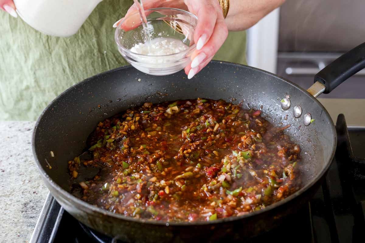 mixing cornstarch and water in a small bowl