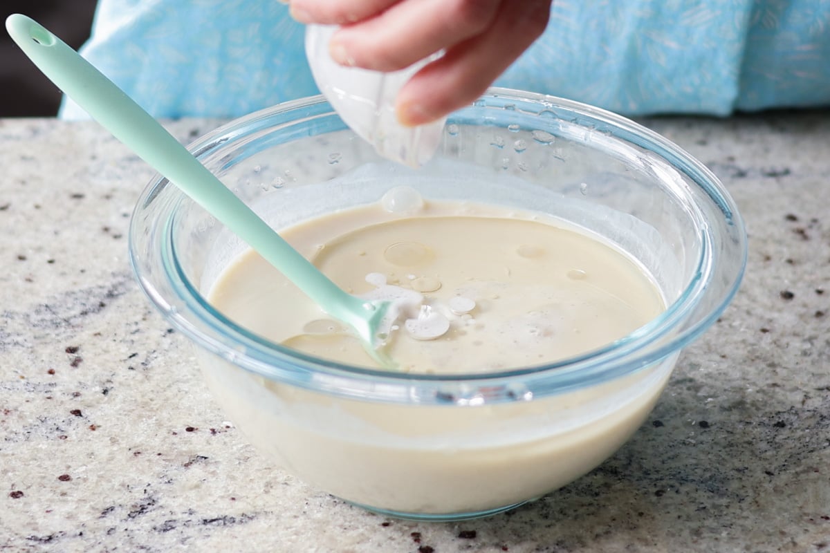 adding wet ingredients to the bowl