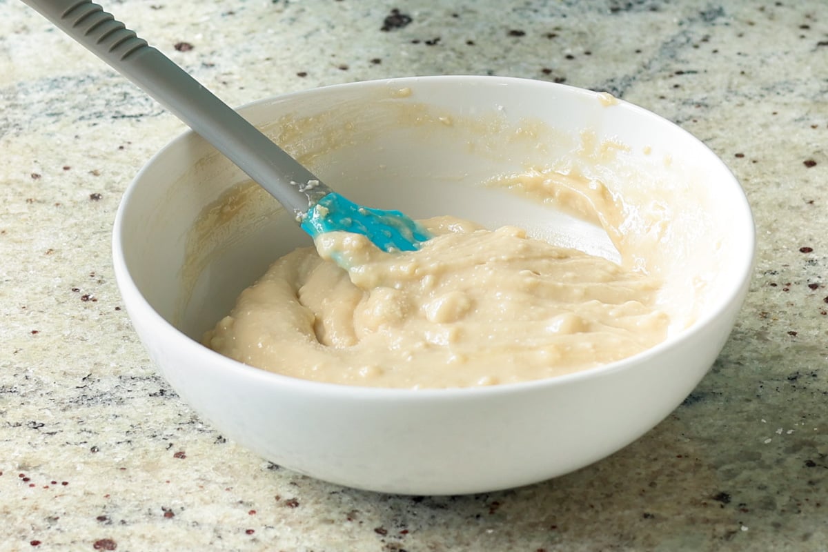 cream cheese frosting in the bowl after mixing