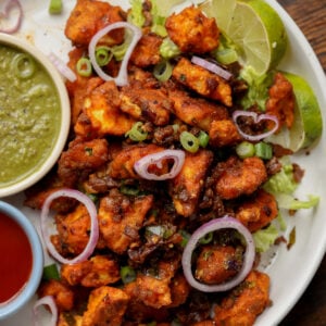 vegan chicken 555 on a plate with chutneys for dipping