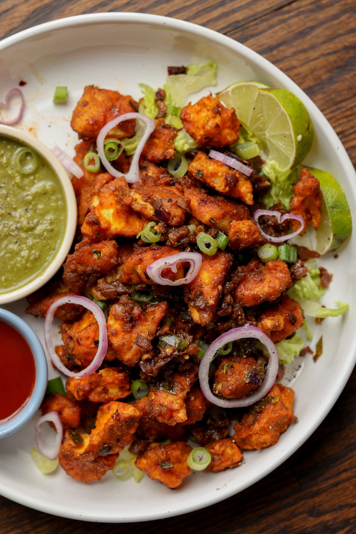 vegan chicken 555 on a plate with chutneys for dipping