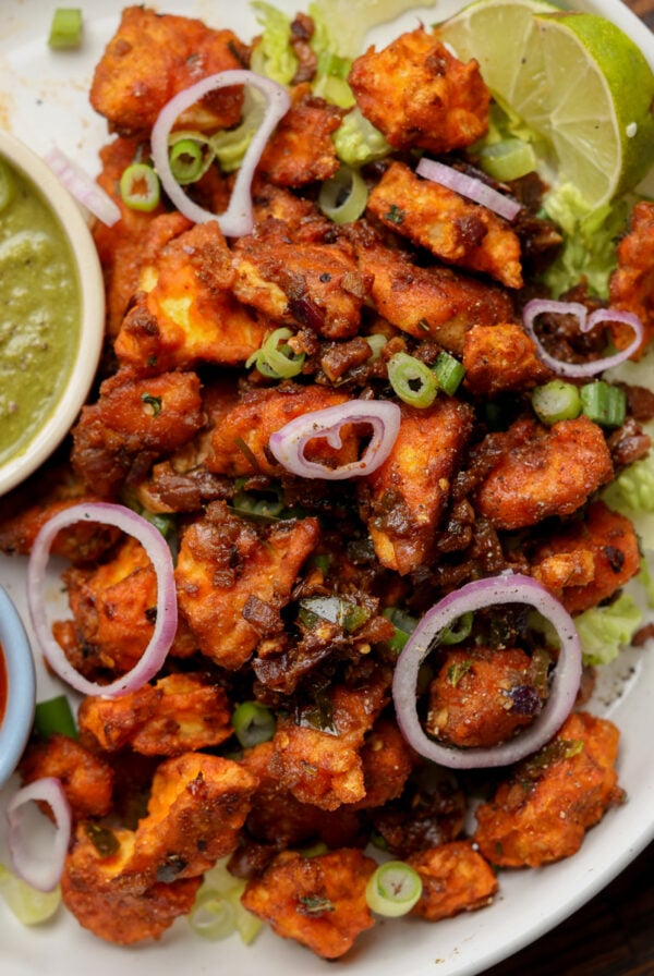 vegan chicken 555 on a plate with chutneys for dipping