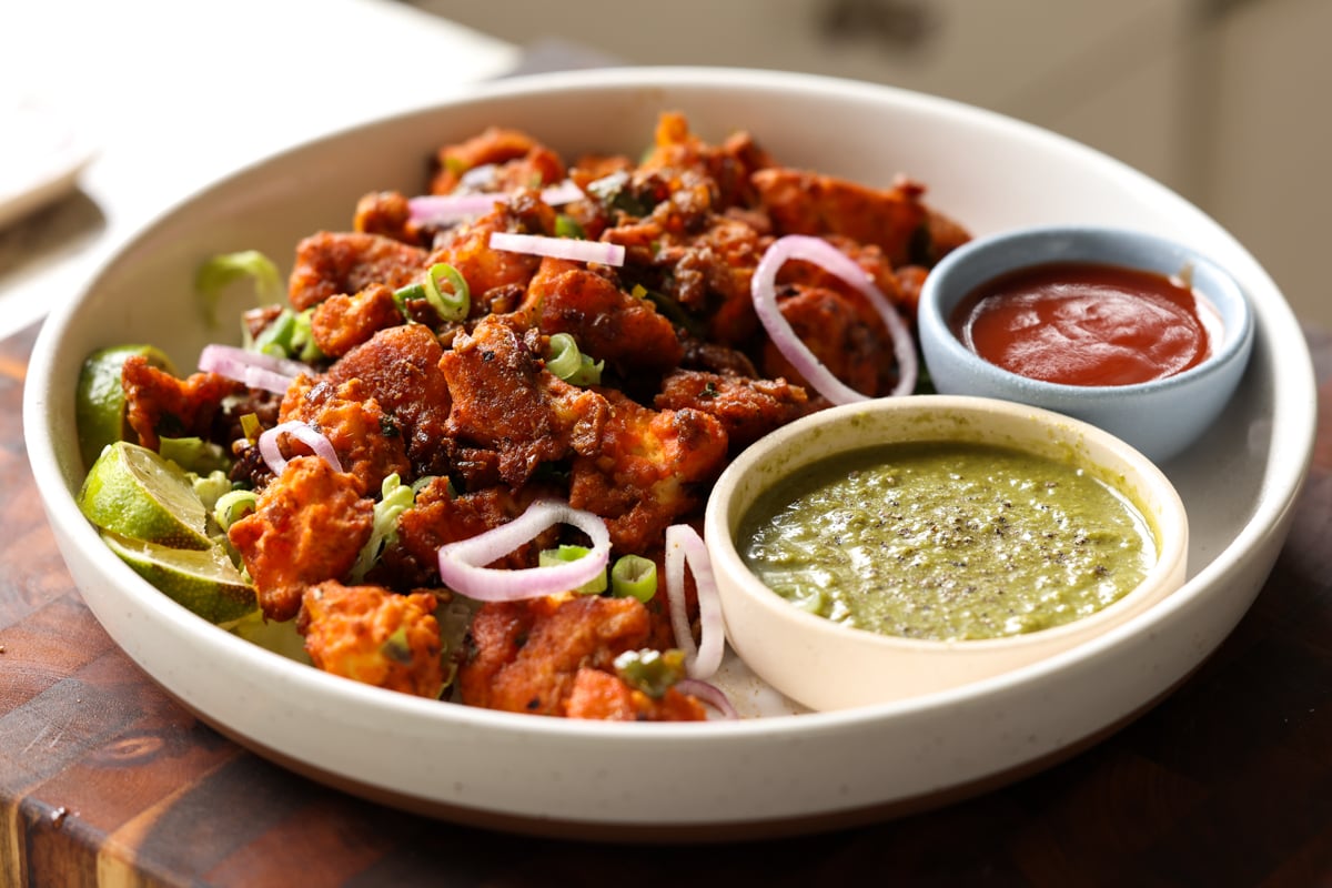 vegan chicken 555 on a plate with chutneys for dipping