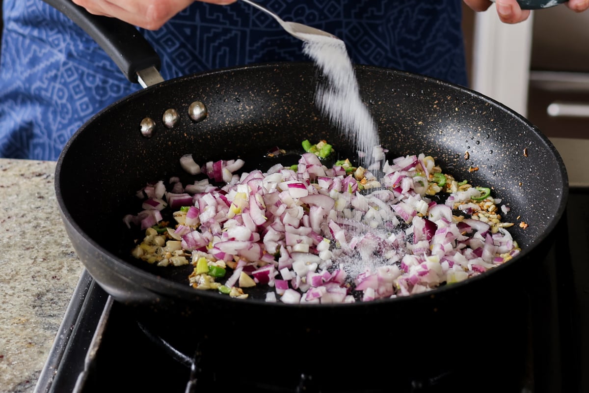 adding onion to the pan
