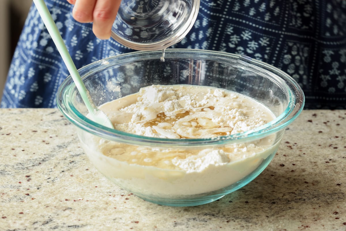 adding wet ingredients to the dry ingredients