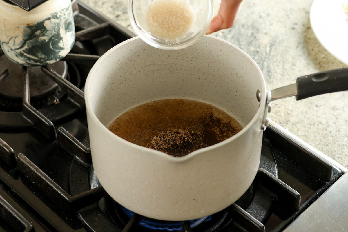 adding chai ingredients to the pan