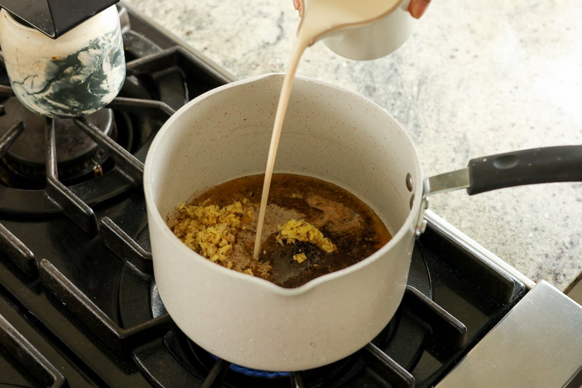 adding non-dairy milk to the pan