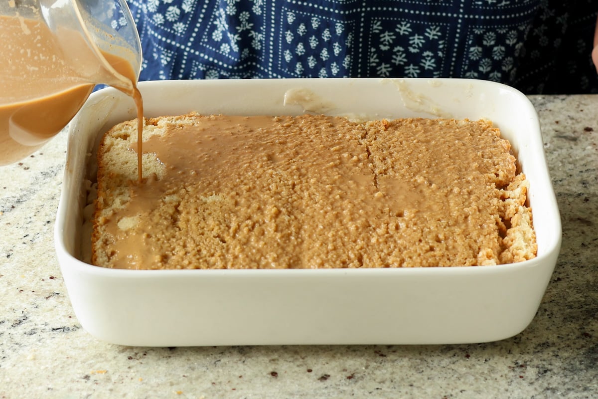 pouring the chai onto second cake layer