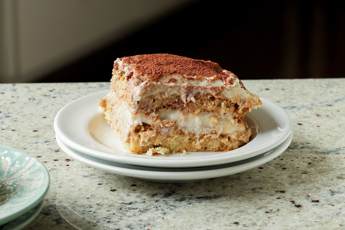 slice of chai tiramisu cake on a plate