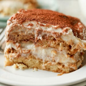 close-up of slice of chai tiramisu cake on a plate