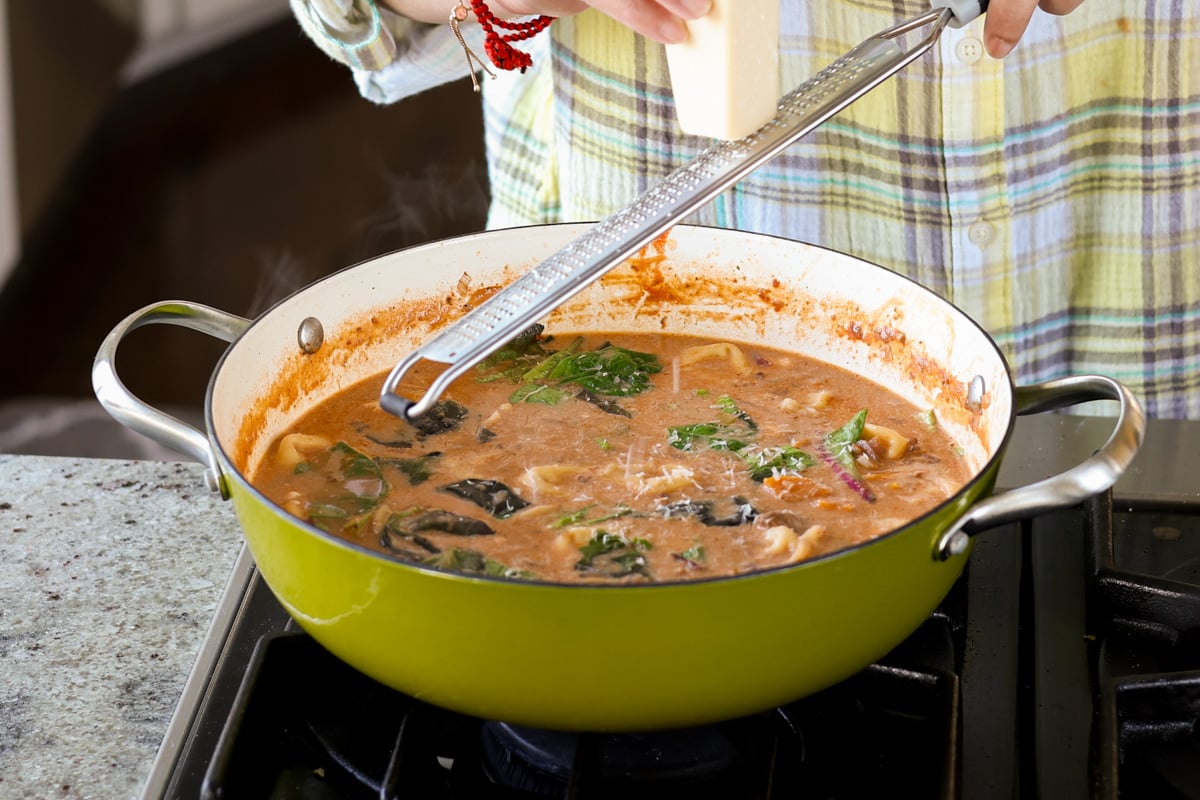 adding toppings to the pan