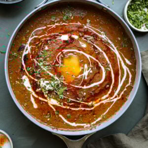 dal makhani in the pan with tadka and toppings