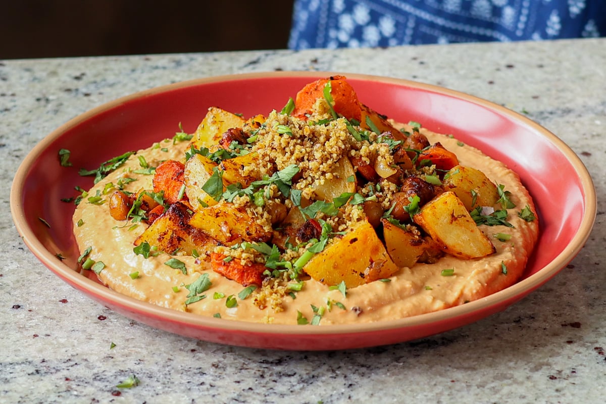 harissa bean puree topped with roasted vegetables and baharat walnuts