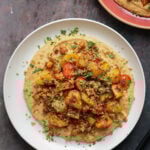 harissa bean puree topped with roasted vegetables and baharat walnuts