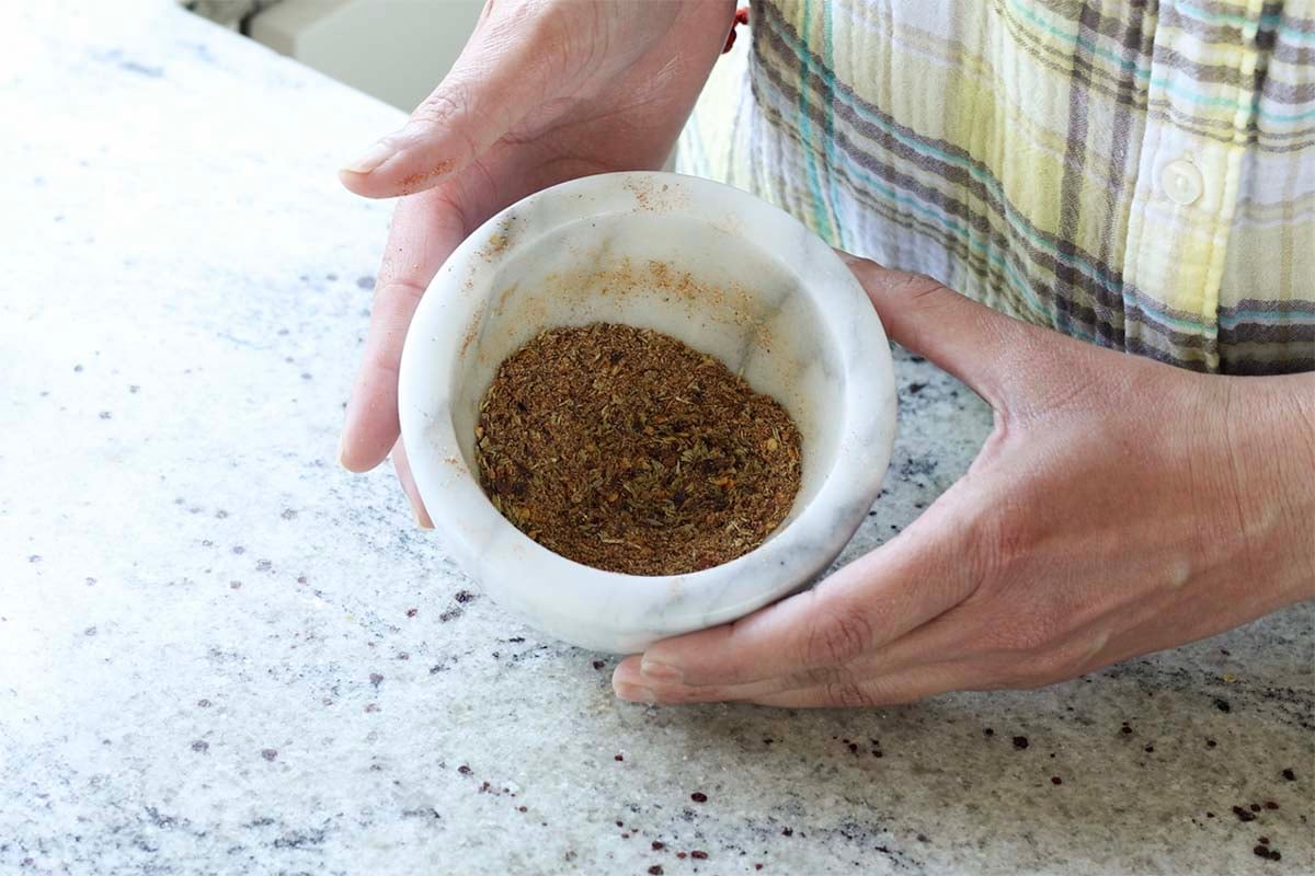 sausage spice mix in the mortar and pestle after grinding