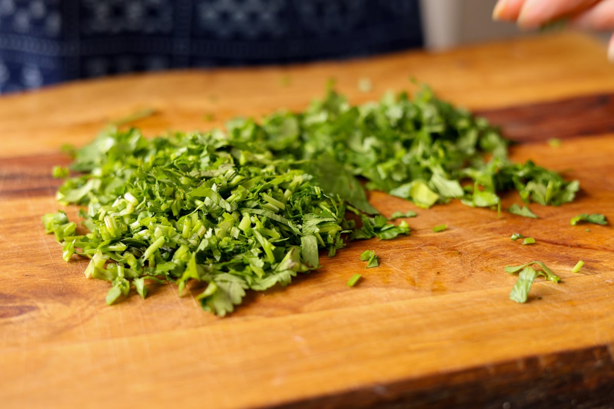 chopped fresh herbs on the cutting board