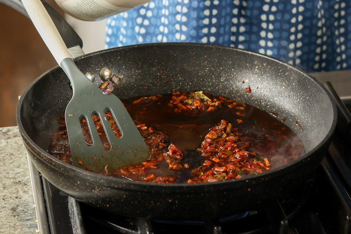 adding sauces to the pan