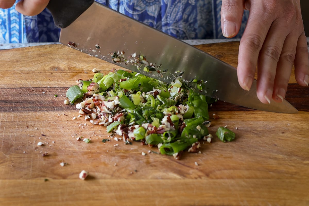 chopping up the toppings ingredients