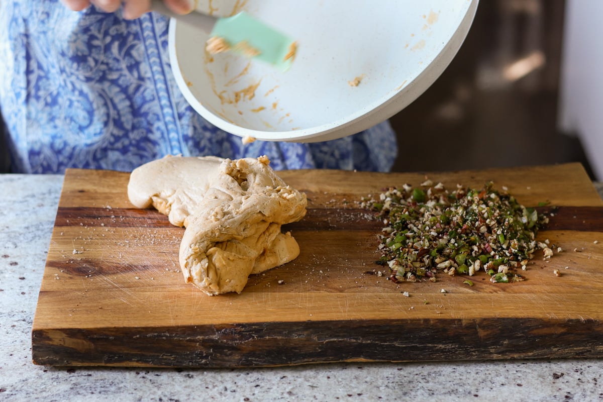 transferring cooled cheese log base to the cutting board