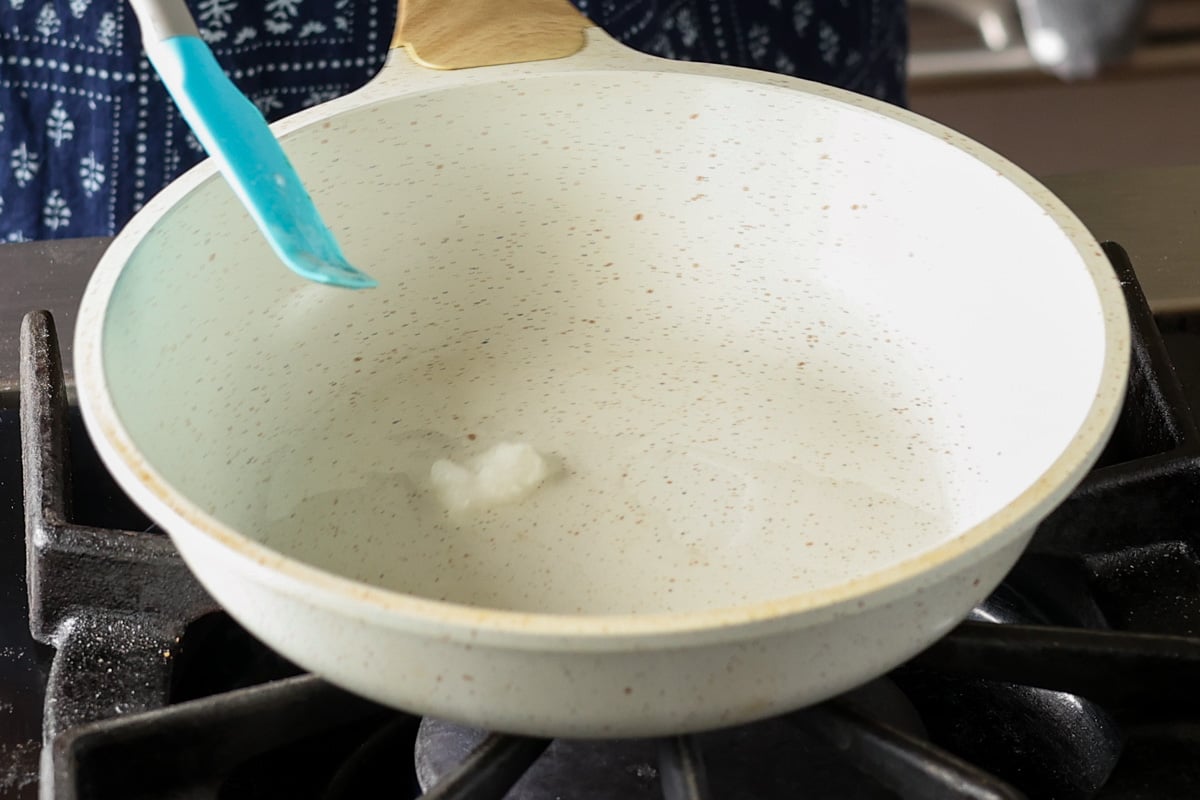adding coconut oil and non-dairy milk to the pan