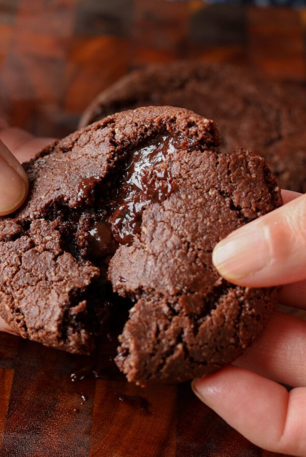 breaking open a lava cookie so you can see the inside