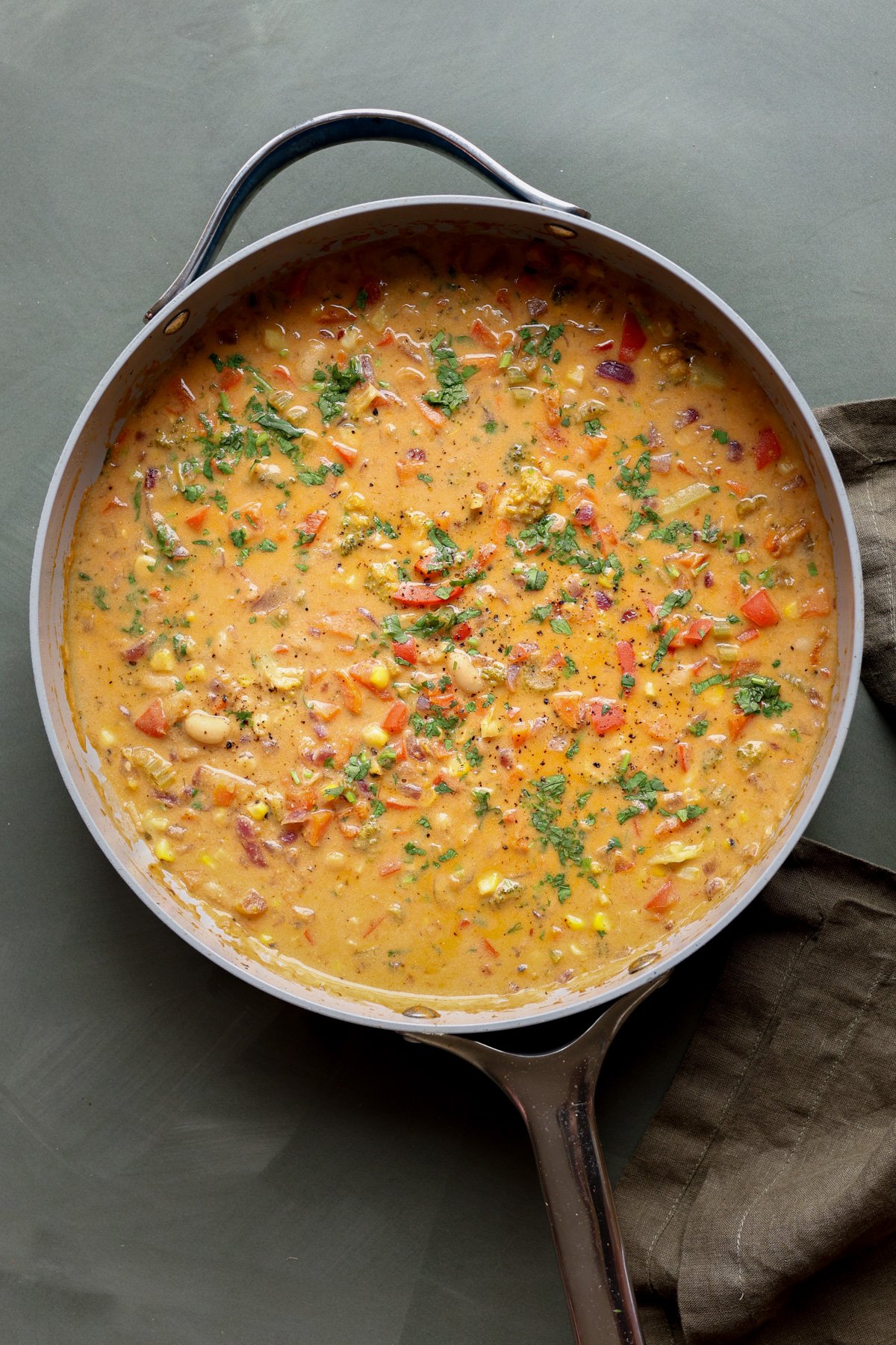 lemon white bean soup in the pan with garnishes