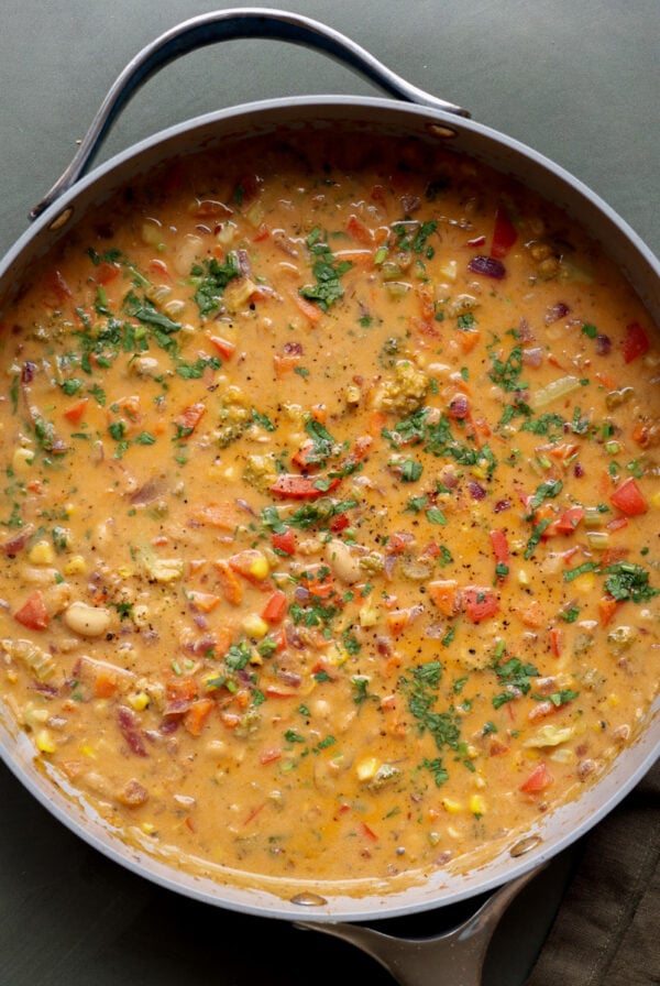 lemon white bean soup in the pan with garnishes