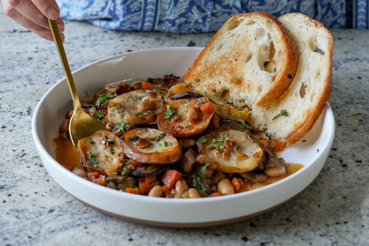 taking a bite of mushroom potato casserole