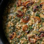 close-up of spinach mushroom beans in the pan with garnish