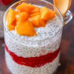 strawberry chia pudding topped with fresh mango