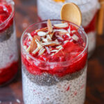 strawberry chia pudding topped with strawberry compote and slivered almonds
