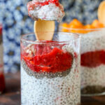 spoon taking a bite of strawberry chia pudding