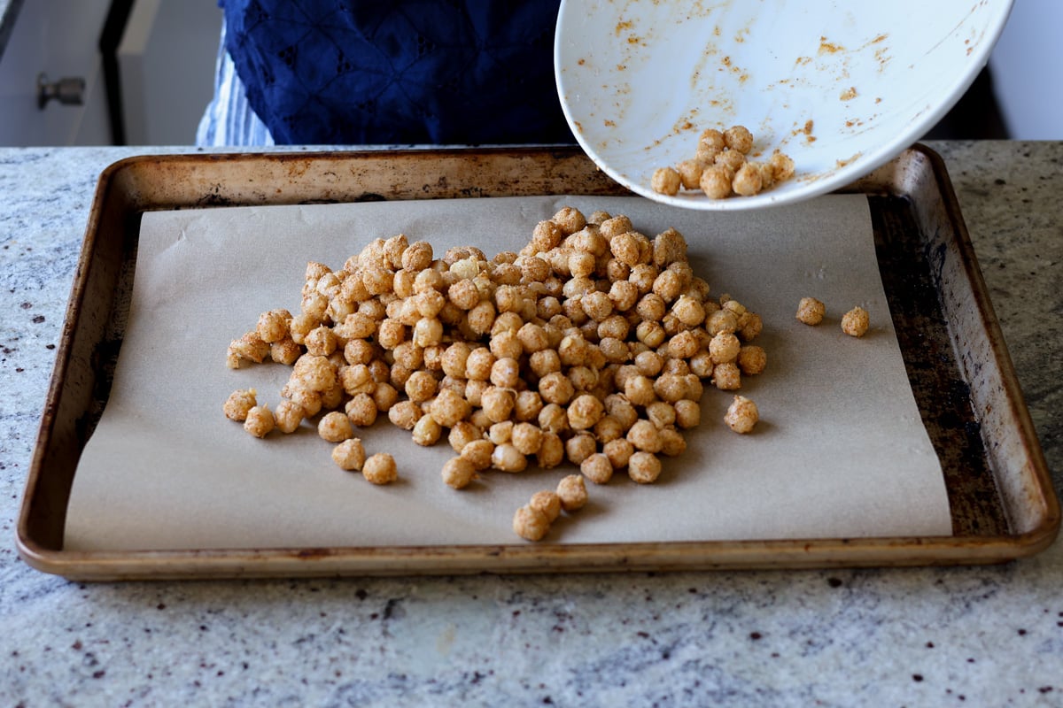 transferring chickpea mixture to the baking sheet