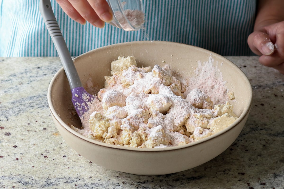 adding cornstarch to the tofu