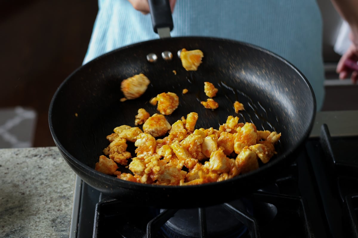 flipping the tofu in the pan