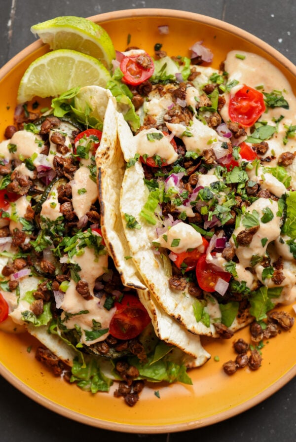 tacos made with chipotle whipped tofu, roasted zucchini, and crispy lentils