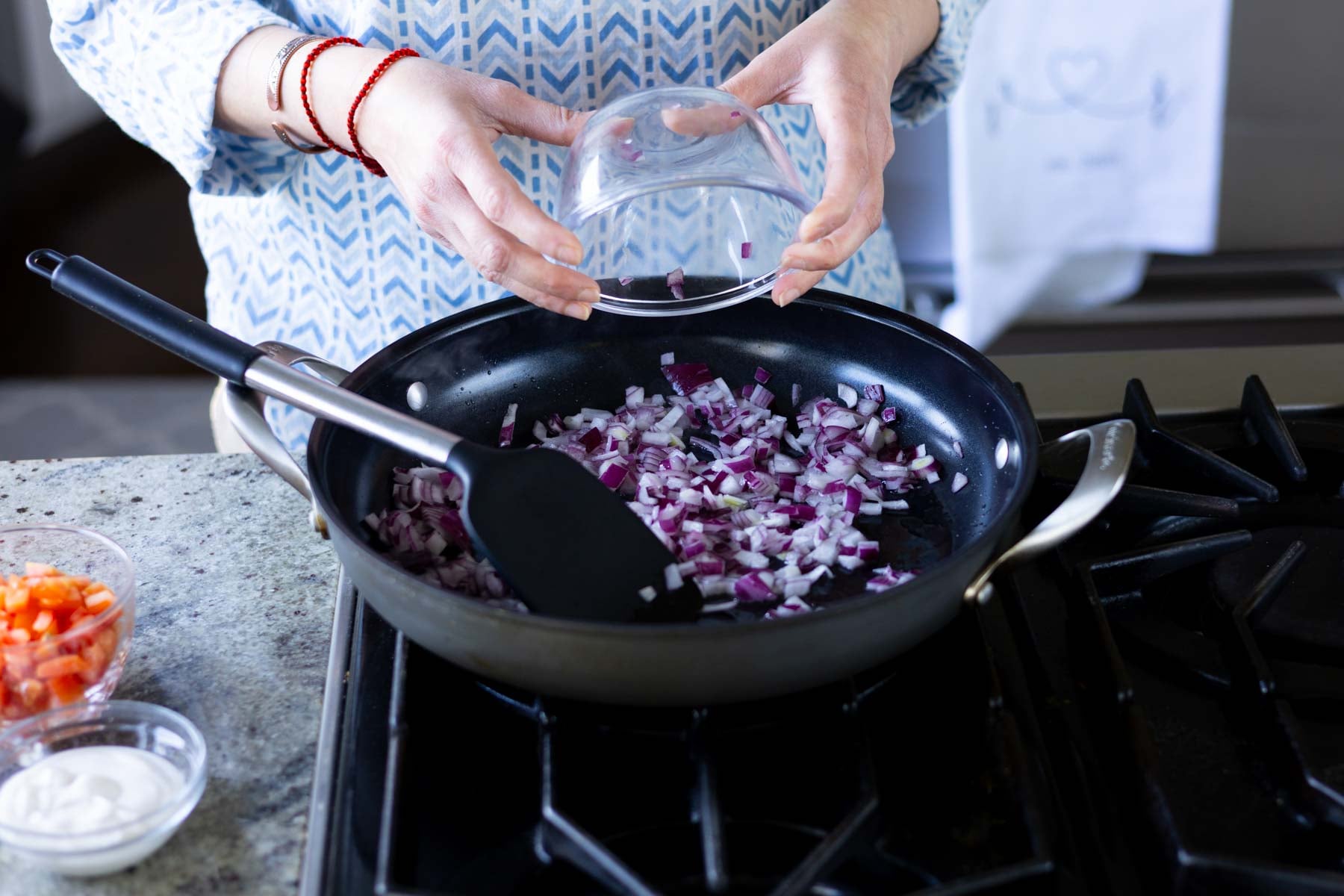 adding onion to the pan