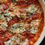 close-up of skillet gnocchi in the pan with tofu ricotta and sun dried tomato sauce