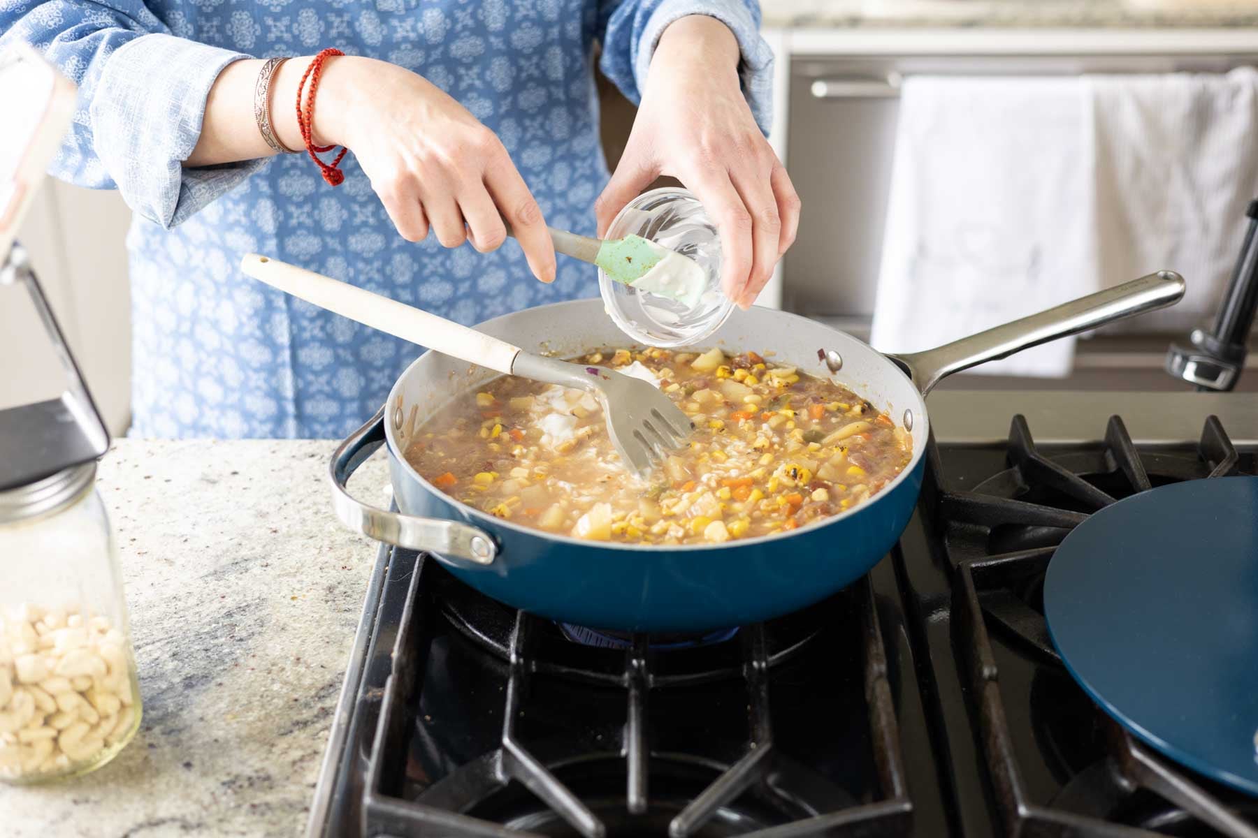 adding non-dairy cream to the pan