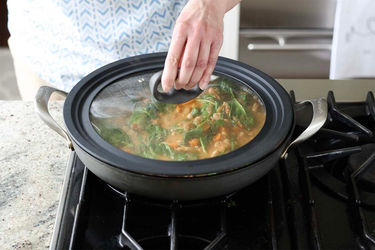 covering the pan with the lid