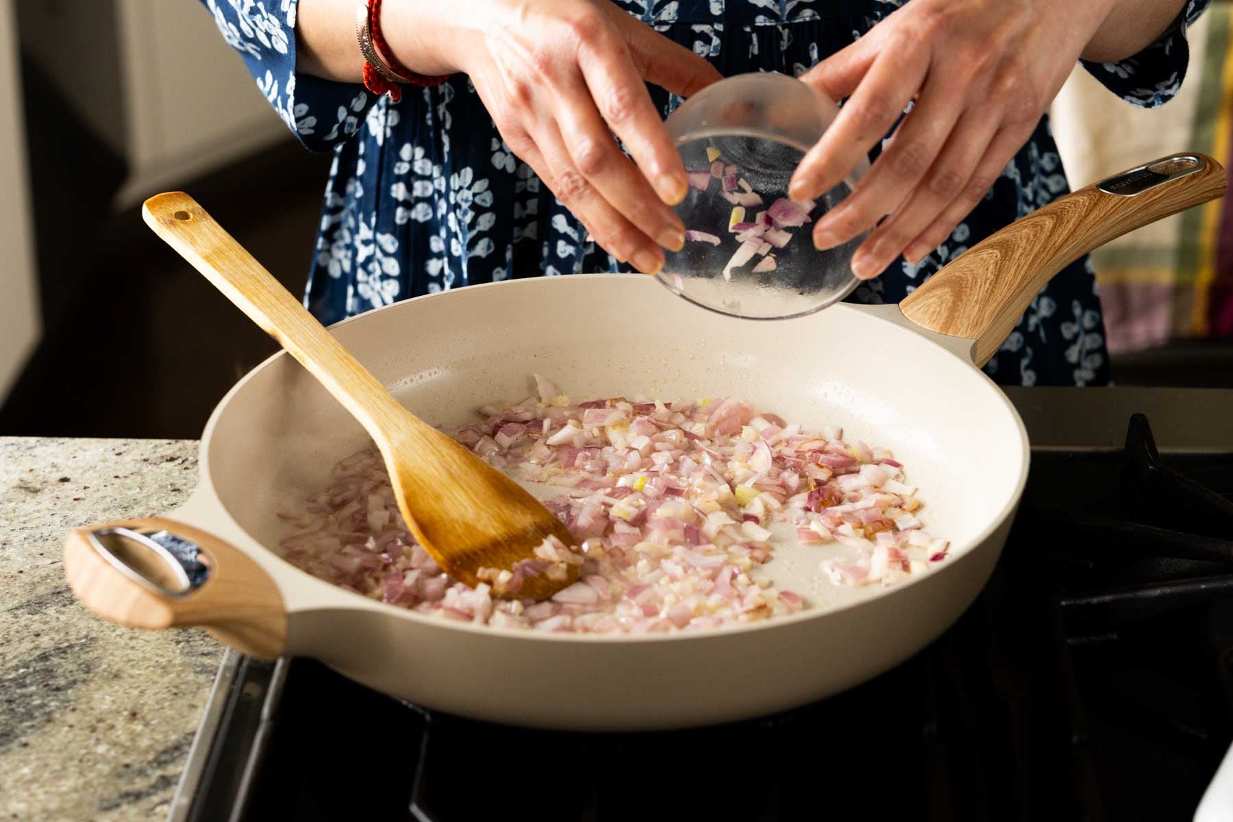 sautéing the onions and garlic in the pan