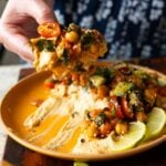 scooping up some of the peri-peri chickpeas from the dip platter