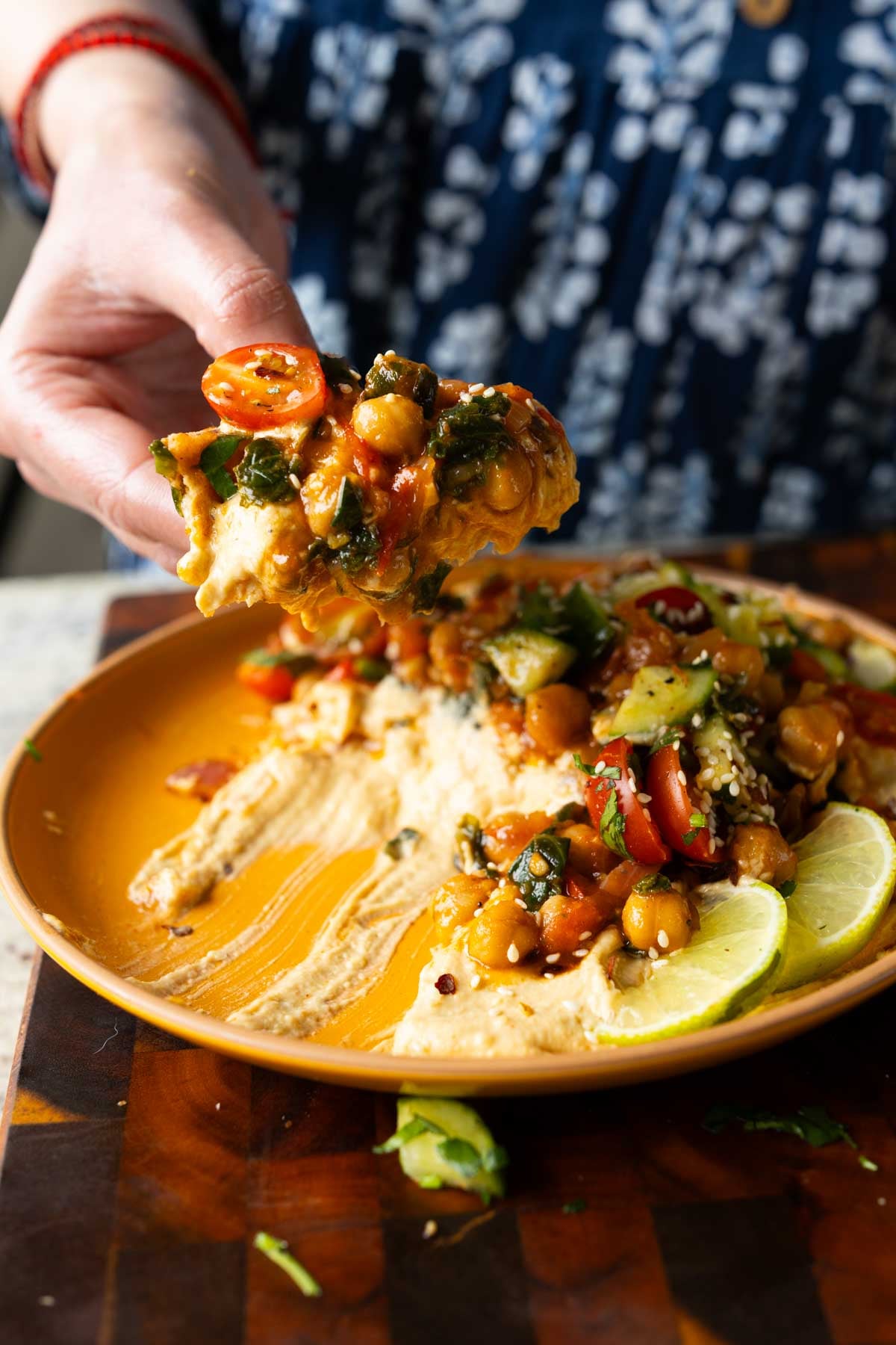 scooping up some of the peri-peri chickpeas from the dip platter
