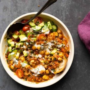 bowl of peri-peri chickpeas topped with the salsa and other garnishes