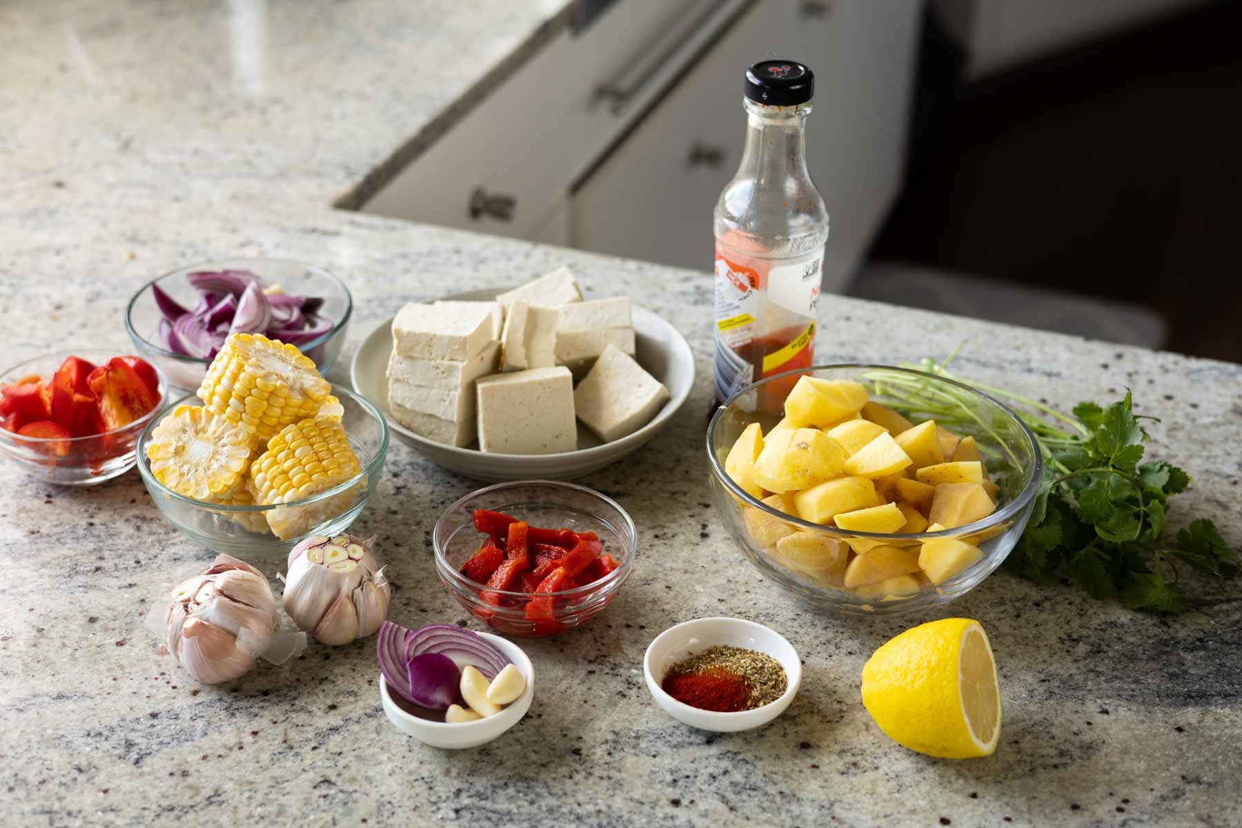 sheet pan peri-peri dinner ingredients on the kitchen counter