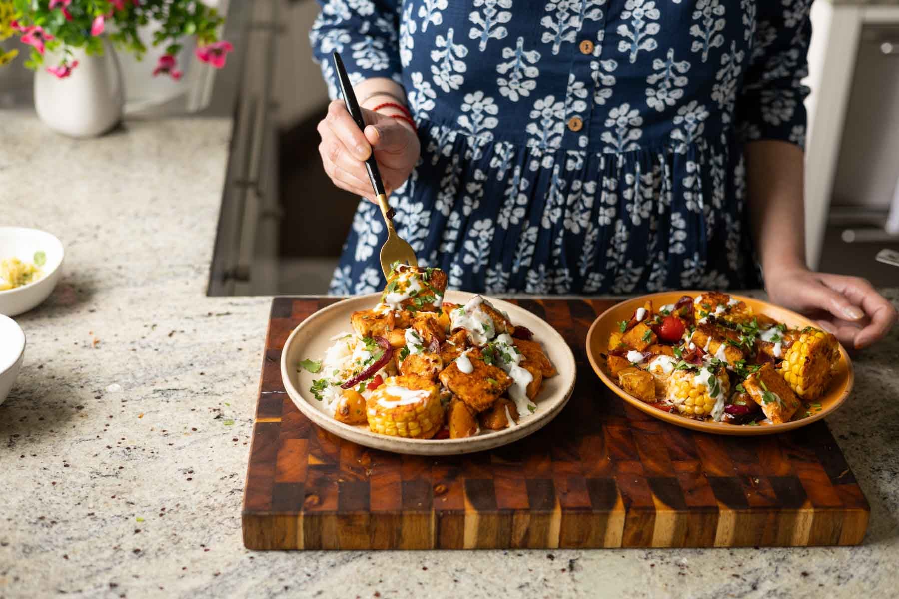 fork taking a bite of peri-peri tofu and vegetables