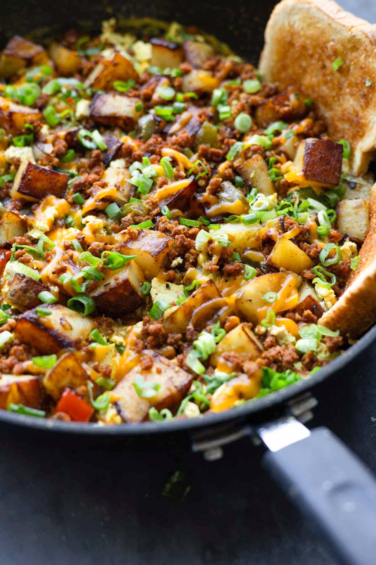 close-up of vegan country breakfast skillet in the pan with toast