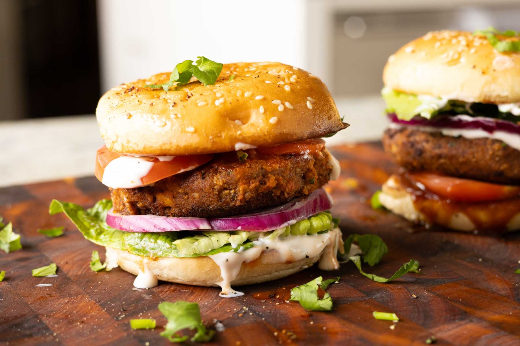 chickpea mushroom burgers on a wooden cutting board