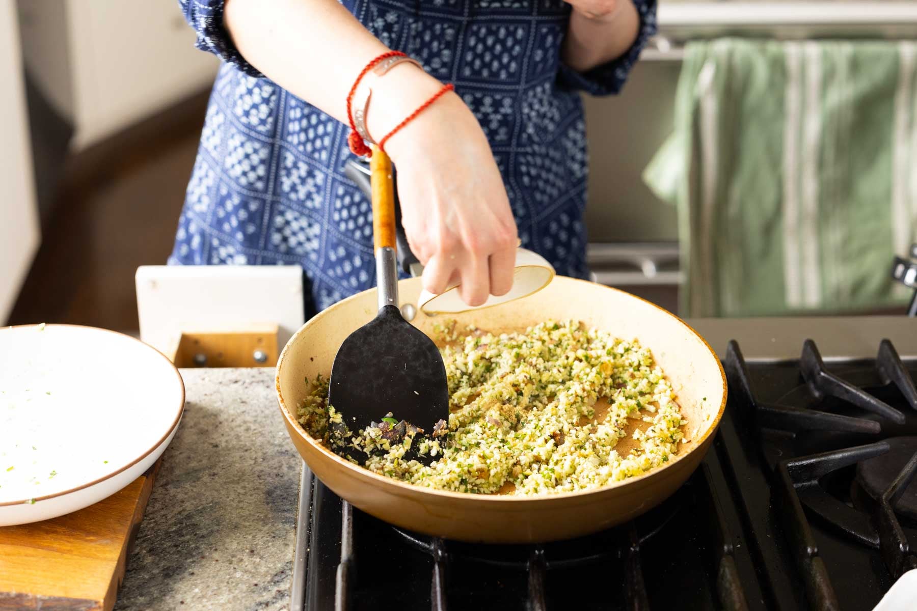 adding spices to the pan